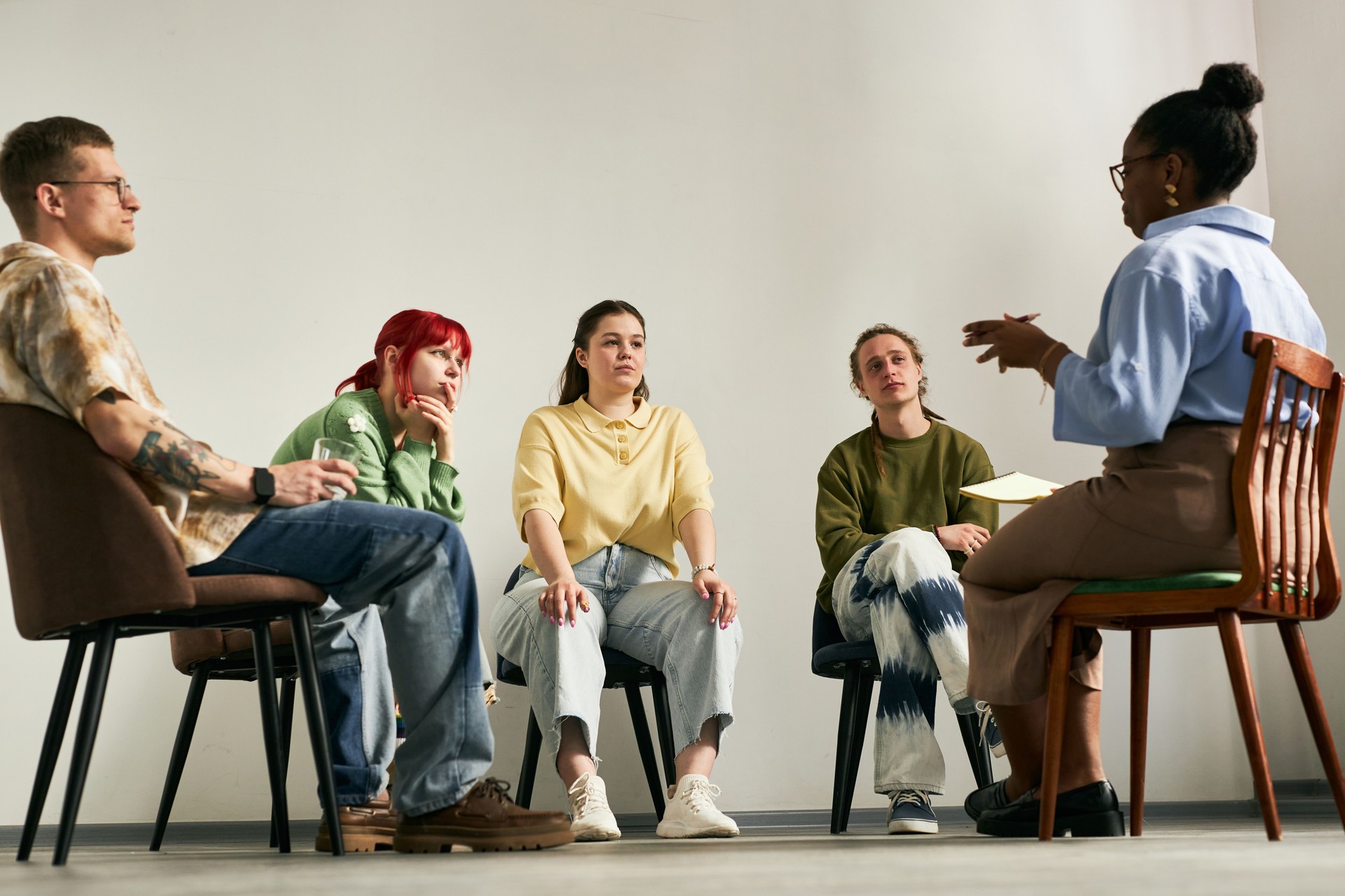 Engaging in Group Therapy Session with Diverse Participants